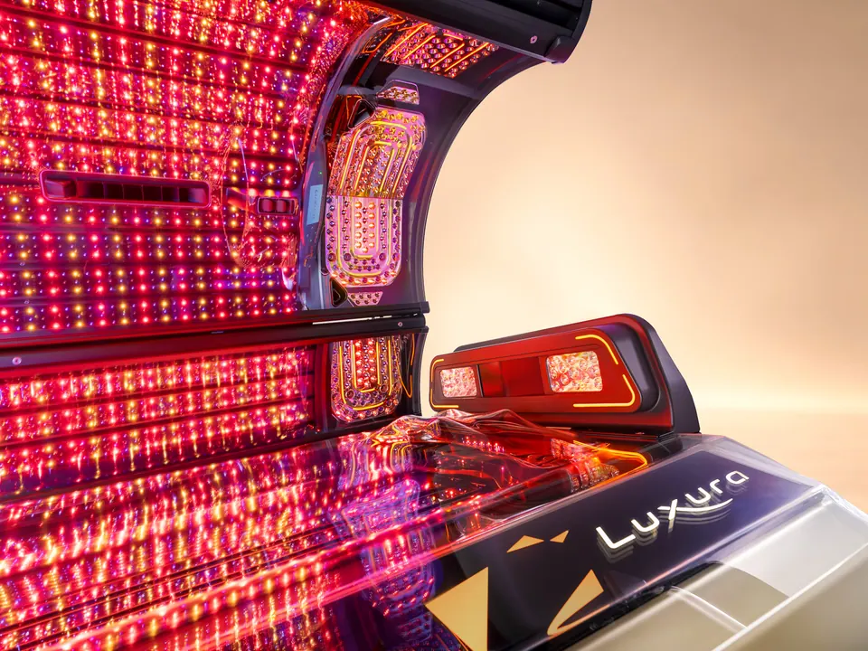 Inside the Jewel Elite: rows of red, amber and violet LEDs across the canopy and bench, with the shoulder tanner unit lit at the head end