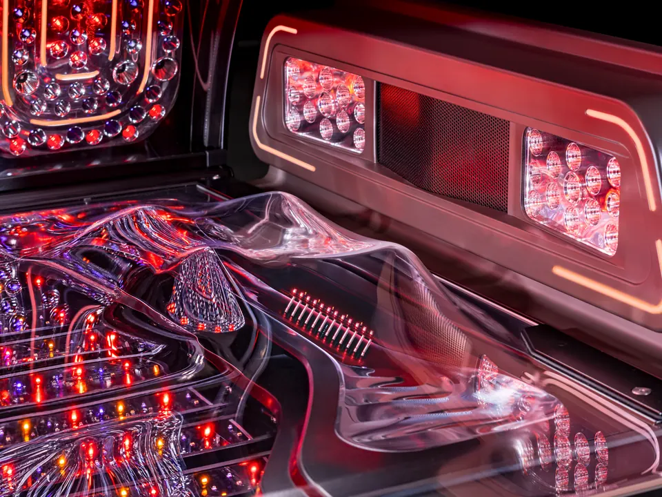 The head end of the Jewel Elite: a row of LEDs set into the clear acrylic bench and the lit shoulder tanner unit beyond it