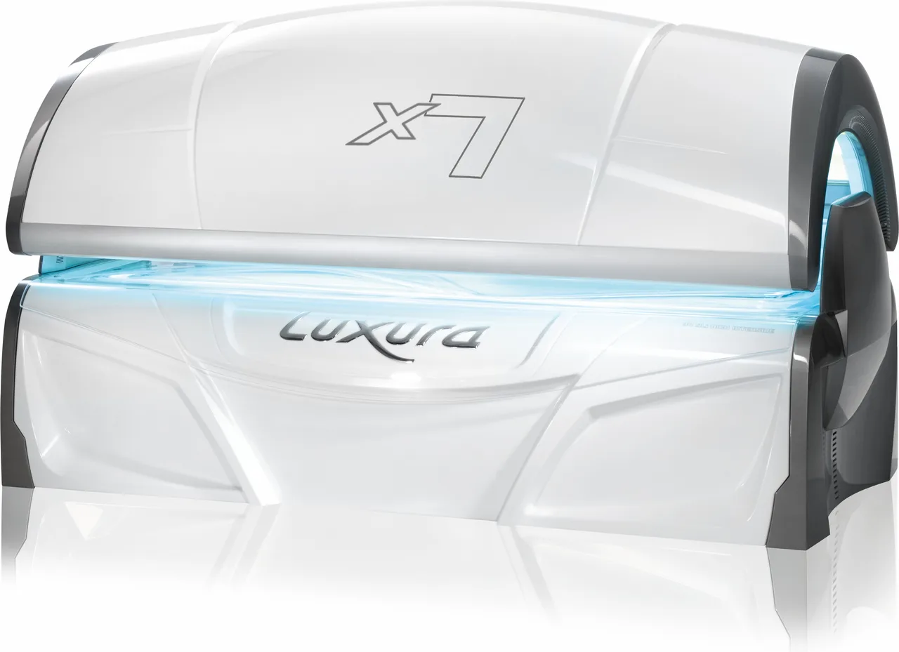 A white Luxura X7 Special, closed, seen from three-quarters with blue light showing between the canopy and bench