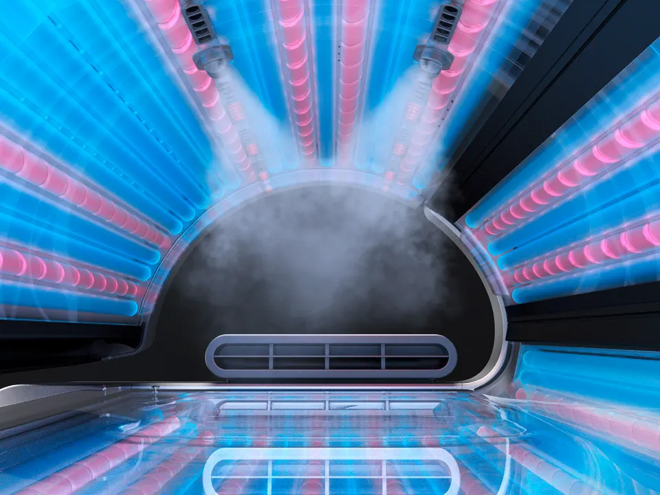 AquaCool mist spraying from two nozzles inside the P9S canopy, tubes lit blue and pink